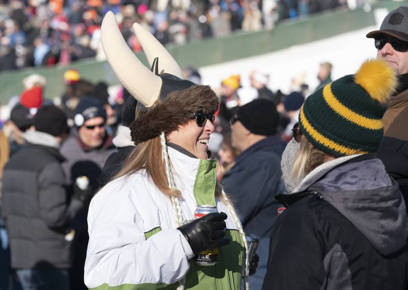 Jennifer Kamarek, of Lake in the Hills, talks with friends in between ski jumping competition at the Norge Annual Winter Ski Jump Tournament on Sunday, January 26, 2025 at the Norge Ski Jump in Fox River Grove.