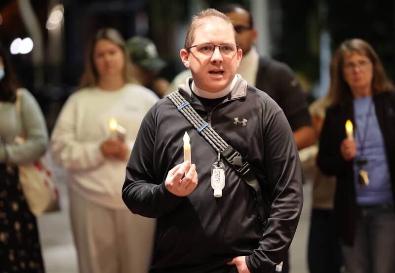 Pastor Mark Patrick, from Grace Place Campus Ministries at Northern Illinois University, speaks Monday, Oct. 3, 2022, at the Egyptian Theatre during the Safe Passage domestic violence candlelight vigil.