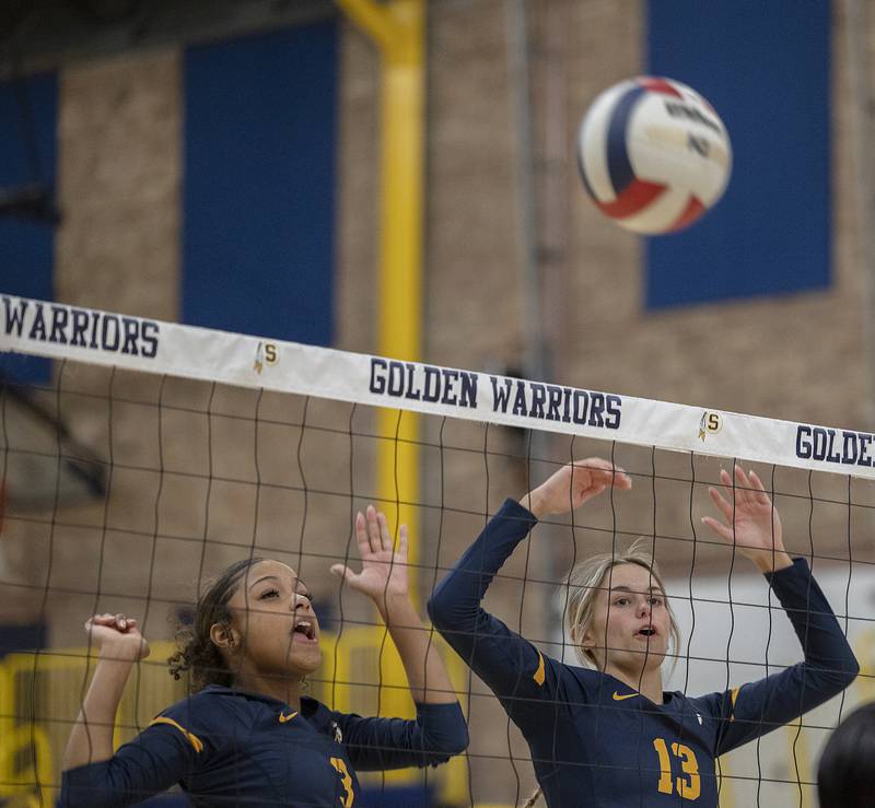 Sterling’s Delali Amankwa (left) and Marley Sechrest work the net against United Township Tuesday, Oct. 15, 2024, in Sterling.