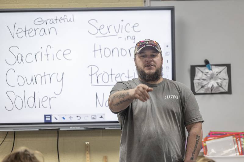 Veteran Derik LaBarron calls on students for questions Monday, Nov. 10, 2025, at Merrill School in Rock Falls. The school celebrated the holiday with speakers and projects throughout the school day.