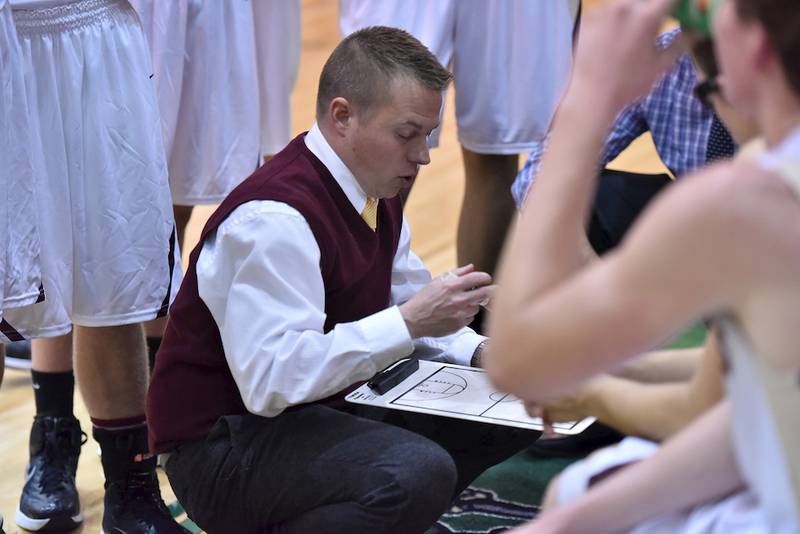 Morris boys basketball coach Joe Blumberg draws up a play during a timeout in their game against Immaculate Conception in the Coal City Turkey Tournament.