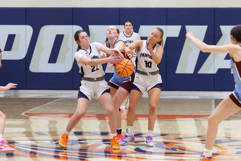 Manteno’s Sophie Peterson, left, and Alyssa Singleton intercept a pass during the Panthers’ 44-23 victory over St. Joseph-Ogden in the IHSA Class 2A Pontiac Sectional semifinal on Tuesday, Feb. 24, 2026, at Pontiac Township High School.