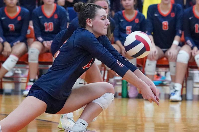 Oswego’s Mia Jurkovic (14) bump sets the ball against Minooka during a volleyball match at Oswego High School on Thursday, Oct. 3, 2024.