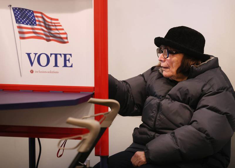 Kathy Watkins, from DeKalb, casts her ballot in the primary election Tuesday, March 17, 2026, at the DeKalb County Administration Building in Sycamore.