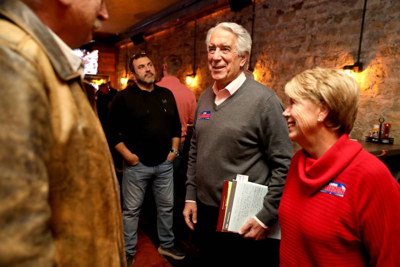 Chris Lauzen, candidate for Kane County Treasurer, and his wife, Sarah, attend an Election Night watch party at Riverside Pizza in St. Charles on Tuesday, Nov. 8. 2022.