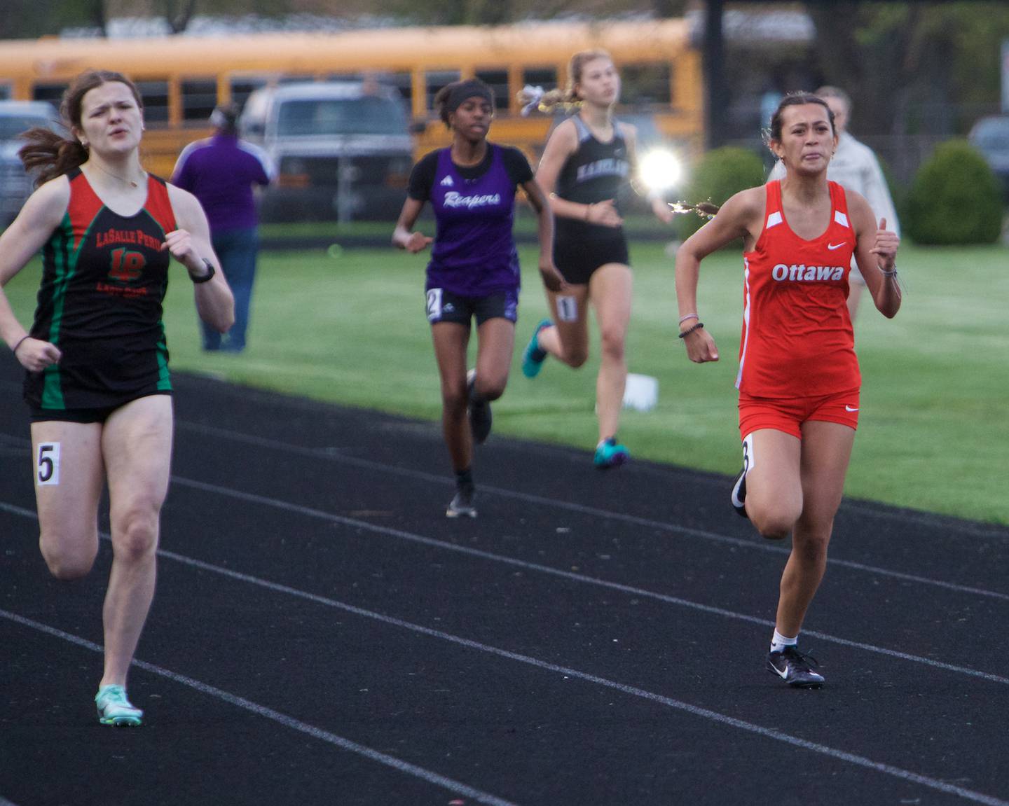 LaSalle's Miah Eugenia Buckley battles with Ottawa's Shaylen Quinn compete in the 400 Meter Dash at the Interstate 8 Girl's track meet on Friday, May,5,2023 in Sycamore.