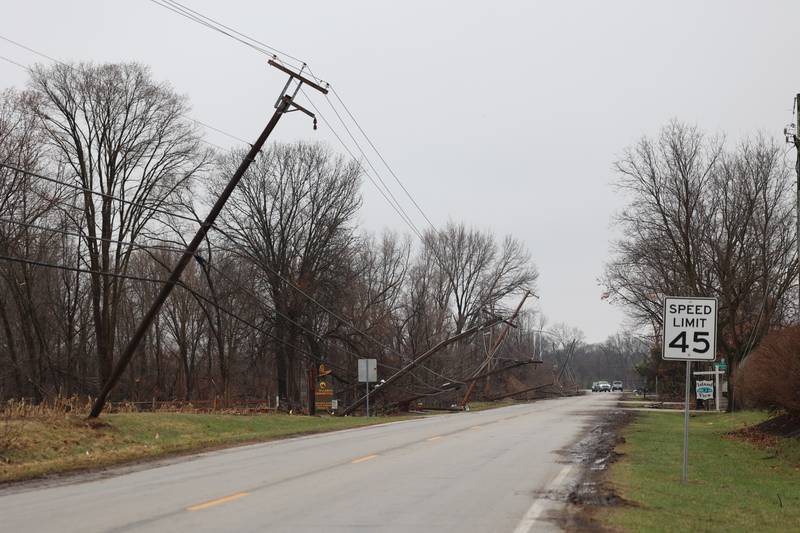Downed power lines partially block Waldron Road in Aroma Park  on March 11, 2026 following a March 10 tornado that passed through Kankakee County.