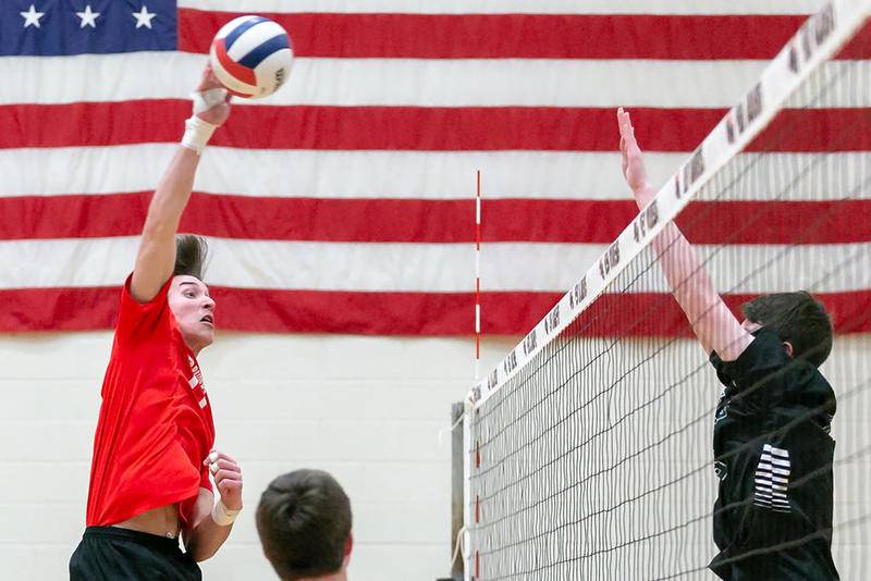 Huntley’s Charlie Johnson puts down a spike against St.Edward on Monday, April 16, 2018 at Huntley. St. Edward went on to win in three sets.