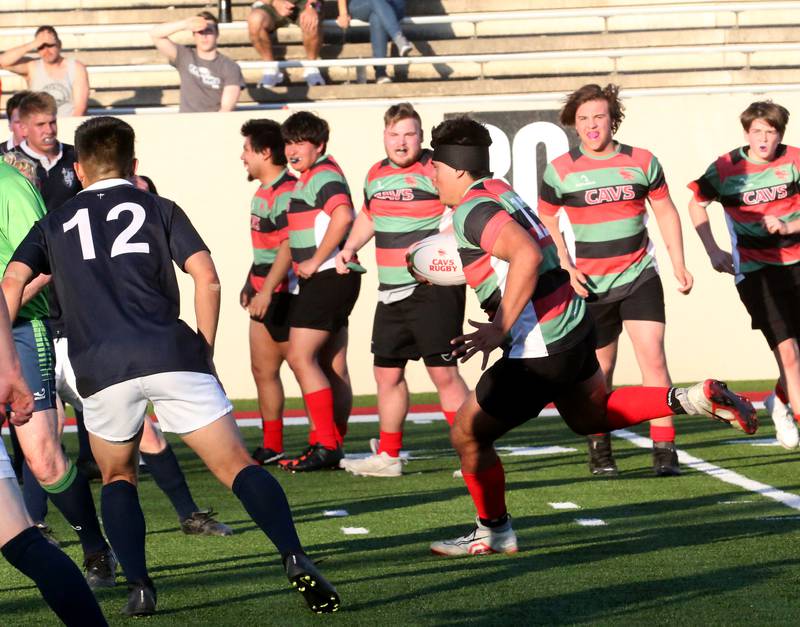 La Salle-Peru's Sean Hollman runs the ball against La Salette Academy during a rugby game on Wednesday, April 12, 2023 at Howard Fellows Stadium at L-P High School.