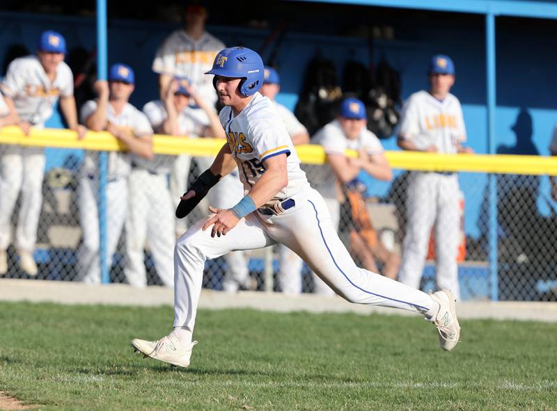 Lyons Township's James Georgelos (15) breaks for home during the boys varsity baseball game between Lyons Township and Downers Grove North high schools in Western Springs on Tuesday, April 11, 2023.