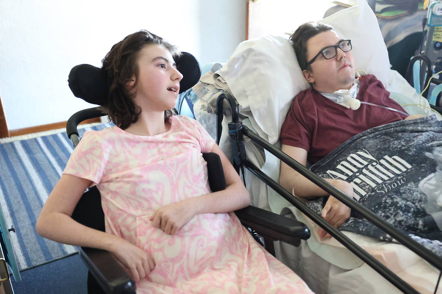 Alyssa Pens and her brother Anthony watch TV in their livingroom on Monday, March 11, 2024 in Coal City.