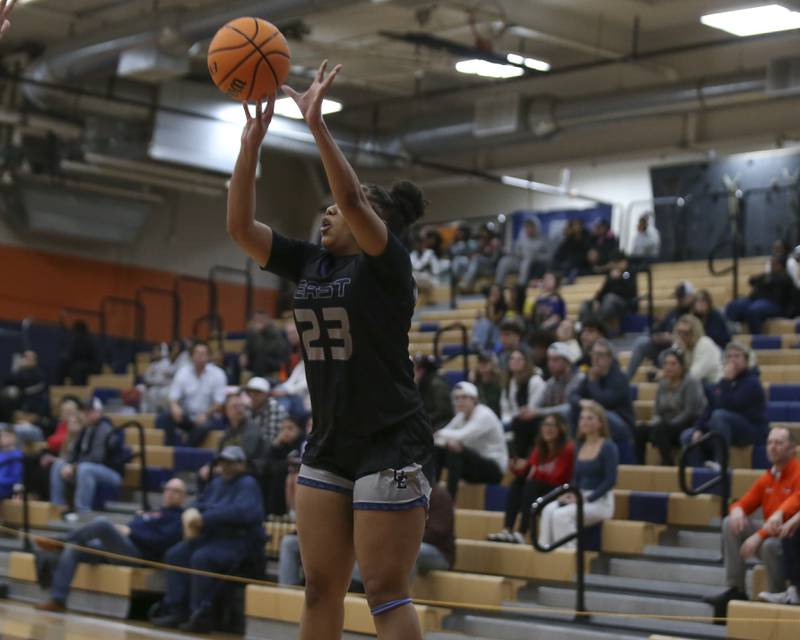 Oswego East's Inspire Fisher (23) shoots a three during their basketball game between Oswego East at Oswego Friday, Jan 09, 2026 in Oswego.