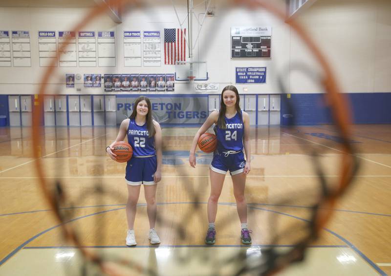 Princeton's Camryn Driscoll and Keighley Davis pose for a photo in Proudy Gym on Wednesday, March 12,, 2025. The girls are the 2024-2025 Bureau County Republican girls basketball players of the year.