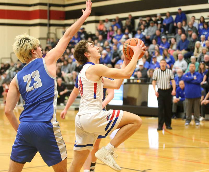 Morrison's Colton Bielema sprints toward the hoop as Princeton's Noah LaPorte defends during the Class 2A Regional final game on Friday, Feb. 23, 2024 at Erie-Prophetstown High School.