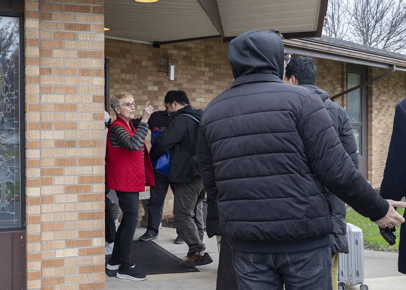 Rock River Valley International Fellowship co-chair Carol Deibert greets the students at the door of the Good Shepard Lutheran Church in Rock Falls.