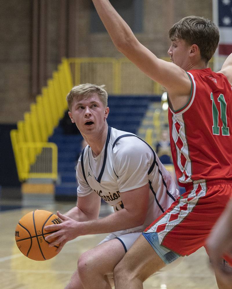 Sterling’s Will Ports looks to make a play against Lasalle-Peru’s Jameson Hill Tuesday, Jan. 7, 2025, at Sterling High School.