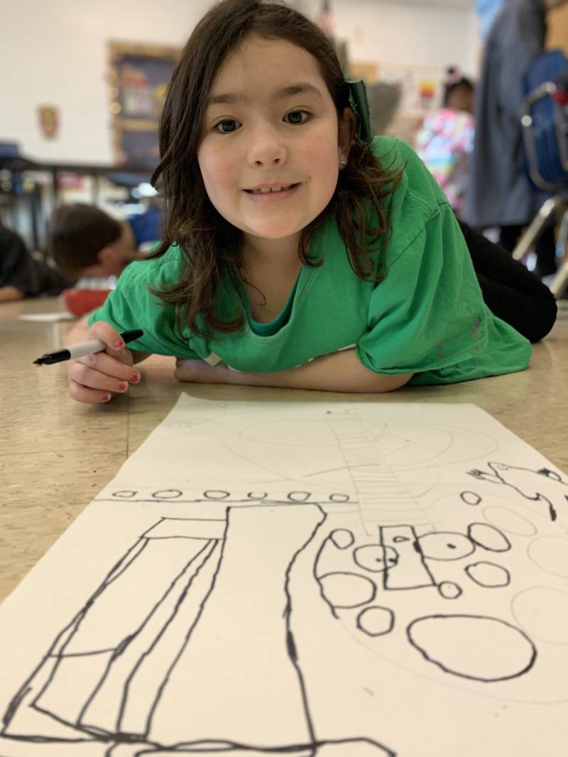 Plano student Elena Acevedo takes her time drawing her artwork which will be on display at the April 13 art show at Emily G. Johns School.