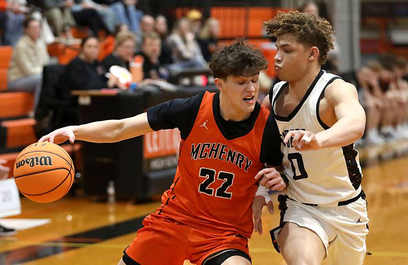 McHenry's Blake Renfro tries to drive to the basket against Crystal Lake Central's Avery Lee during a Fox Valley Conference boys basketball game on Tuesday, February. 10, 2026, at Crystal Lake Central High School.