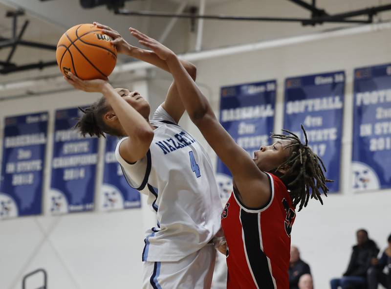 Nazareth's Mia Gage (4) puts up a shot during the girls varsity basketball game between Bolingbrook high school and Nazareth Academy on Monday, Jan. 12, 2026 in La Grange Park.