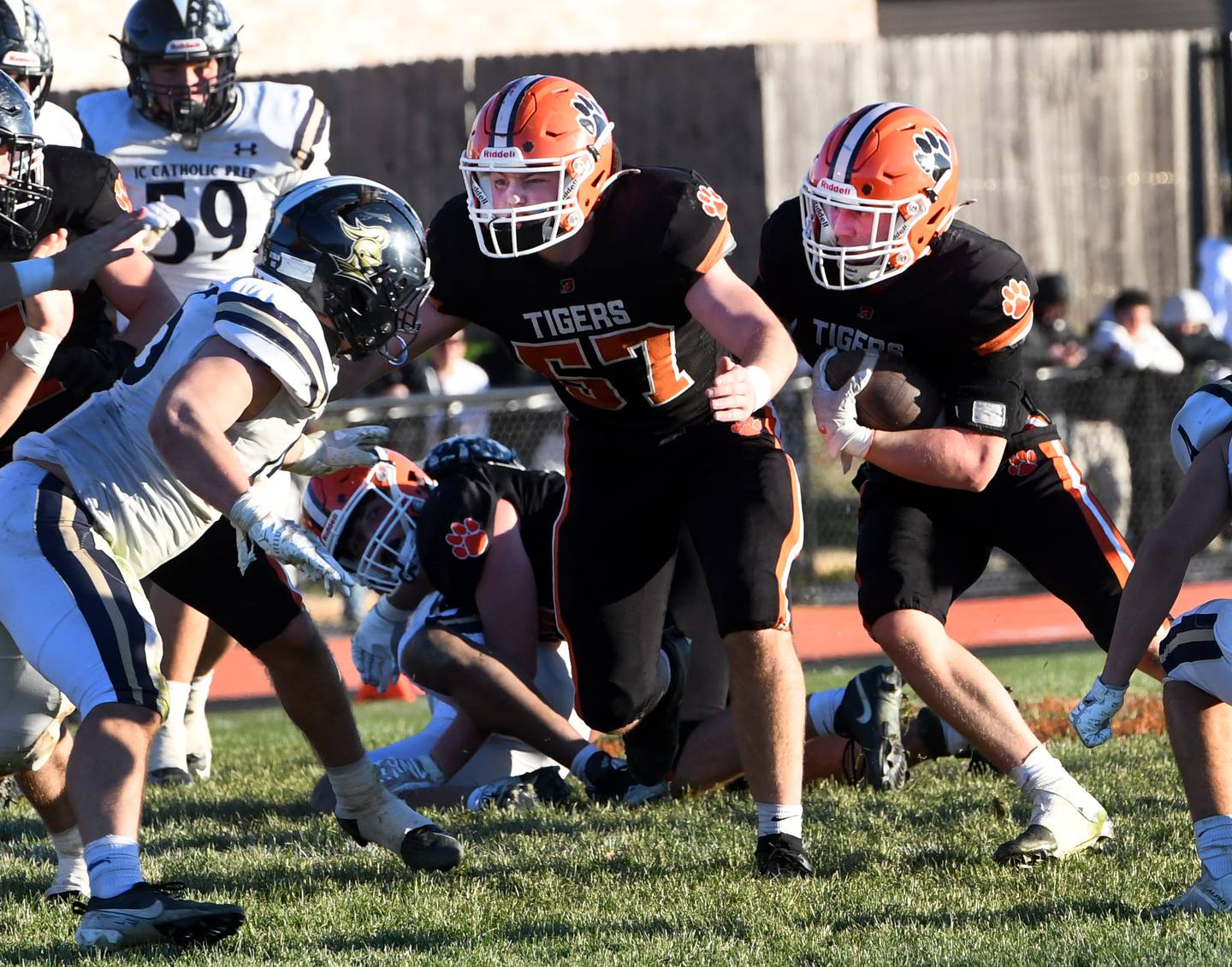 Byron's Caden Considine (37) follows a block by Brody Stien (57) during the 3A quarterfinal game against Elmhurst IC Catholic on Saturday, Nov. 15, 2025 at Byron High School.