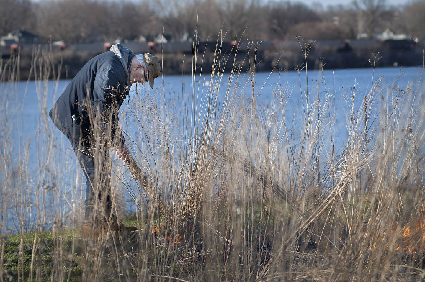 Keller works to get the prairie burn going Monday, April 11, 2022.