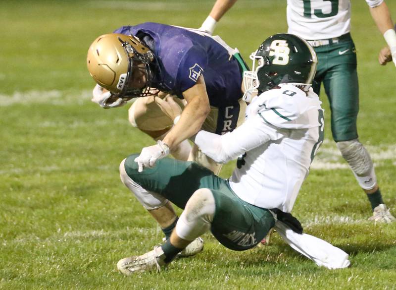 St. Bede's Gino Ferrari gets called for a face mask call while bringing down Marquette's Payton Gutierrez.