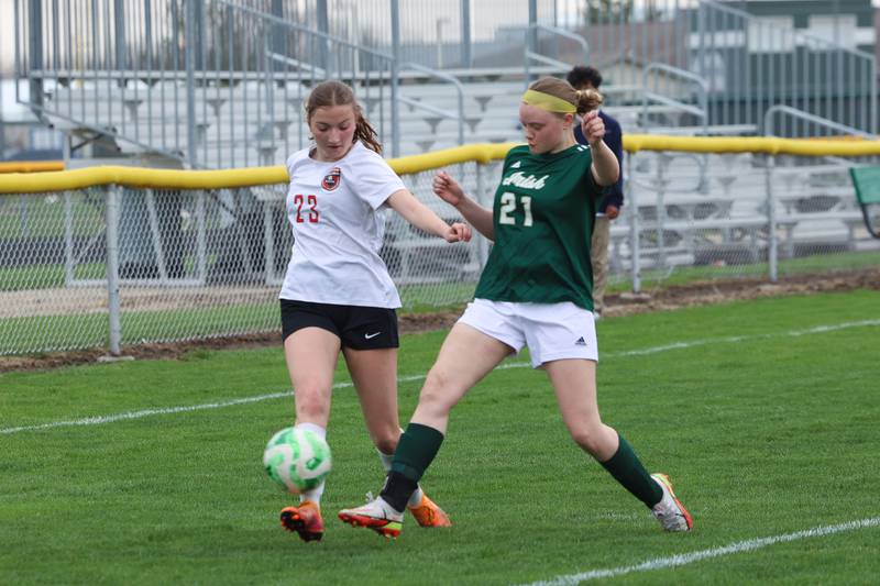 Bradley-Bourbonnais' Sophia Surface, left, looks to cross under pressure from Bishop McNamara's Laura Moore during the Boilermakers' 9-1 win over Bishop McNamara in All-City play on Tuesday, March 31, 2026.