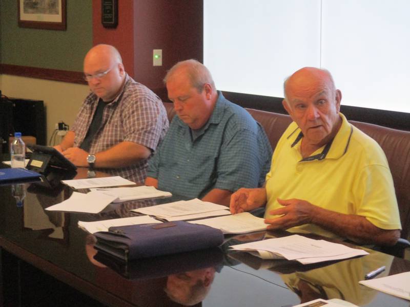 Oswego Fire Protection District Board President Richard Kuhn, right, leads the discussion at the Aug. 8, 2022 board meeting. Board members Rodger Long, center, and Jason Bragg, right, listen. (Mark Foster -- mfoster@shawmedia.com)