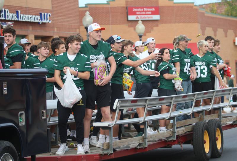 St. Bede football players ride on a a float during the St. Bede Homecoming parade on Friday, Sept. 27, 2024 downtown Peru.