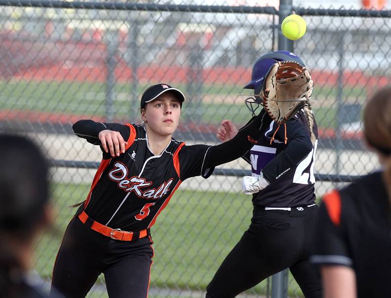 Dixon's Allie Abell beats the throw to first base despite the stretch of DeKalb's Madison Hallaron Thursday, May 22, 2025, during their game at DeKalb High School.