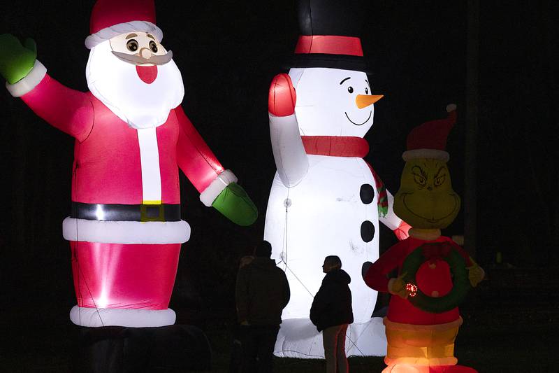 Iconic Christmas characters rise towards the sky Tuesday, Nov. 26, 2024, at Centennial Park in Rock Falls.