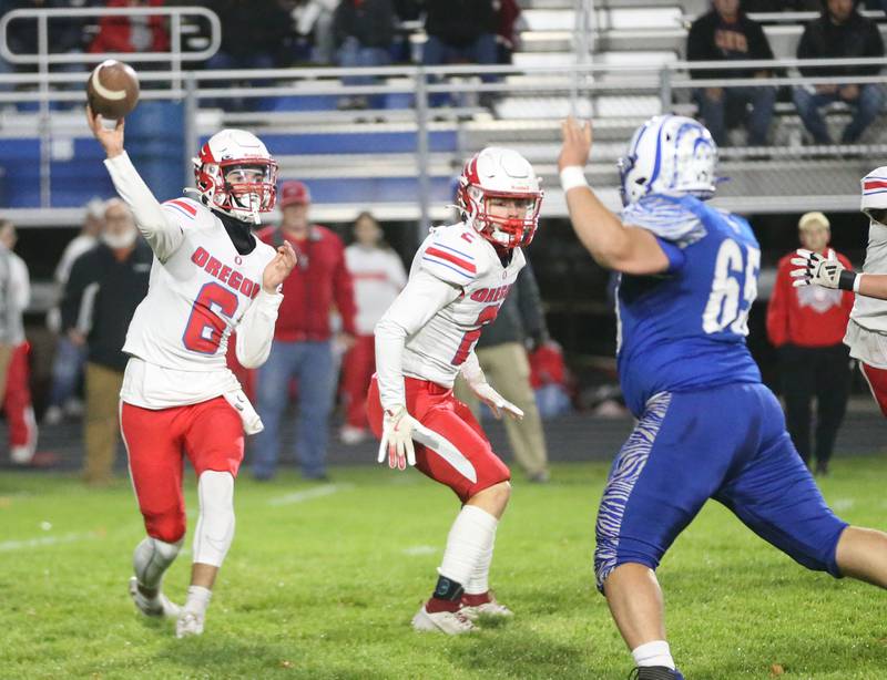 Oregon's quarterback Benny Olalde lets go of a pass as Princeton's Cade Odell eyes the throw during the Class 3A playoff game on Friday, Nov. 1, 2024 at Princeton High School.