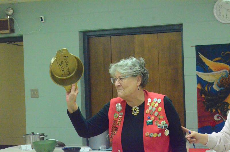Yorkville resident Barb Johnson shows off her gold-colored soup pot trophy after being named the champion of the Norwegian Soup Contest hosted by the Sons of Norway in Montgomery on Feb. 2.