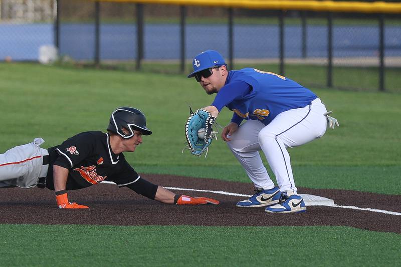Joliet Central’s Cam Rande fields the pickoff throw against Minooka  on Monday, April 6, 2026 in Joliet.