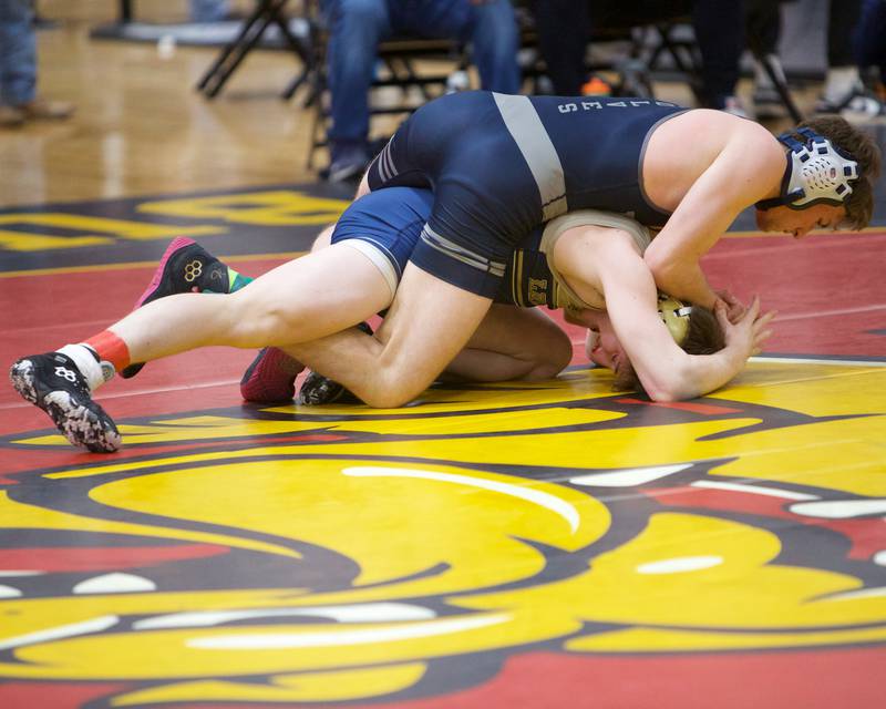 Oswego East's Braeden Grisham competes against Lemont's Jullian Vallianatos in the 138 lb weight class at the Clint Arias Invitational on Saturday, Jan.18,2025 in Batavia.