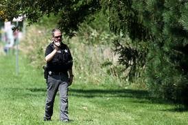 Photos: Investigation continues after body recovered from DeKalb pond