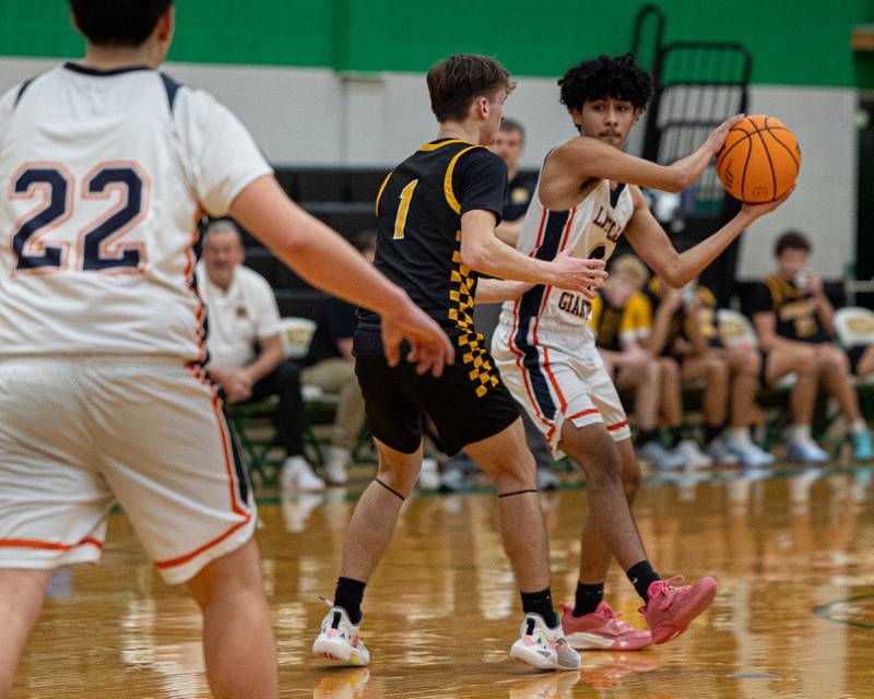 Diego Perez (4) of DePue looks to pass ball to teammate Joel Mendez (22) as Matt Kuban (1) of Reed-Custer guards Perez during game in the Shipyard Showdown on Tuesday, December 23, 2025 at Seneca High School in Seneca.
