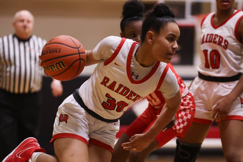 Bolingbrook’s Angelina Smith drives to the basket against Homewood-Flossmoor in the Class 4A Bolingbrook Sectional championship. Thursday, Feb. 24, 2022, in Bolingbrook.