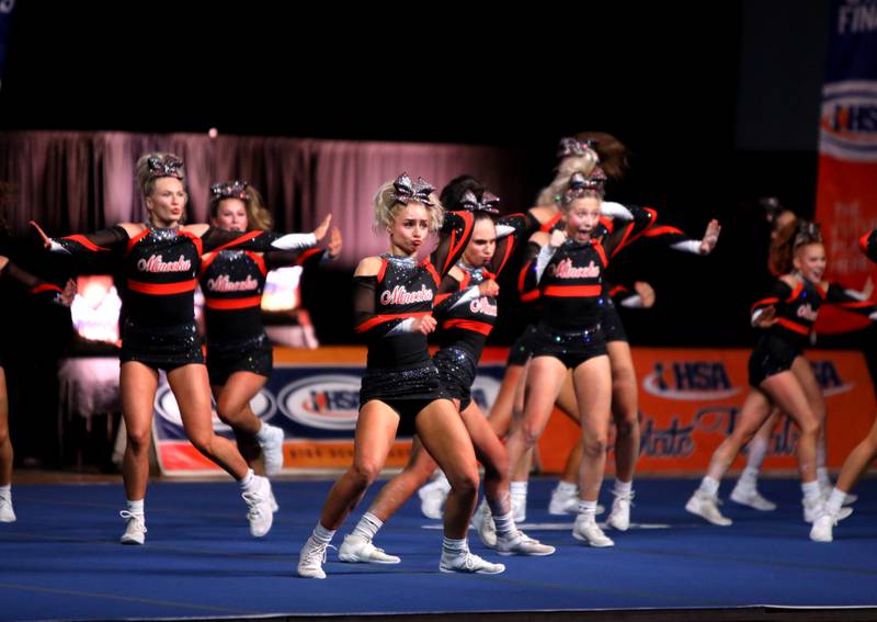 Members of the Minooka cheerleading team compete in the large team division of the IHSA State Finals on Saturday, Feb. 8, 2025 at Grossinger Motors Arena in Bloomington.