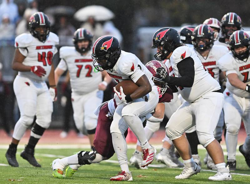 Metamora's Jaiduan Cranford (1) runs the ball during the class 4A second round playoff game against Morris on Saturday, NOV. 08, 2025, at Morris.