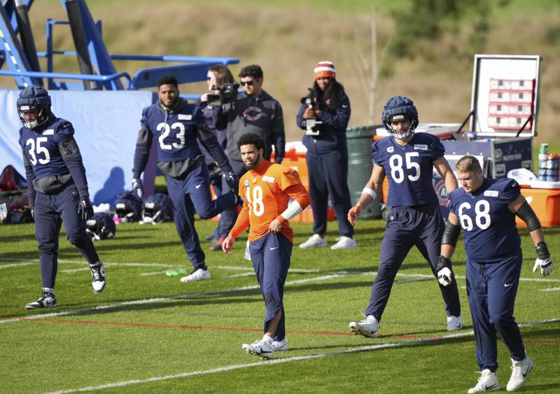 Chicago Bears quarterback Caleb Williams (18) stretches during a training session in Ware, England, Thursday, Oct. 10, 2024, ahead of the game between the Chicago Bears and the Jacksonville Jaguars at Tottenham Hotspur Stadium on Sunday. (AP Photo/Sean Ryan)