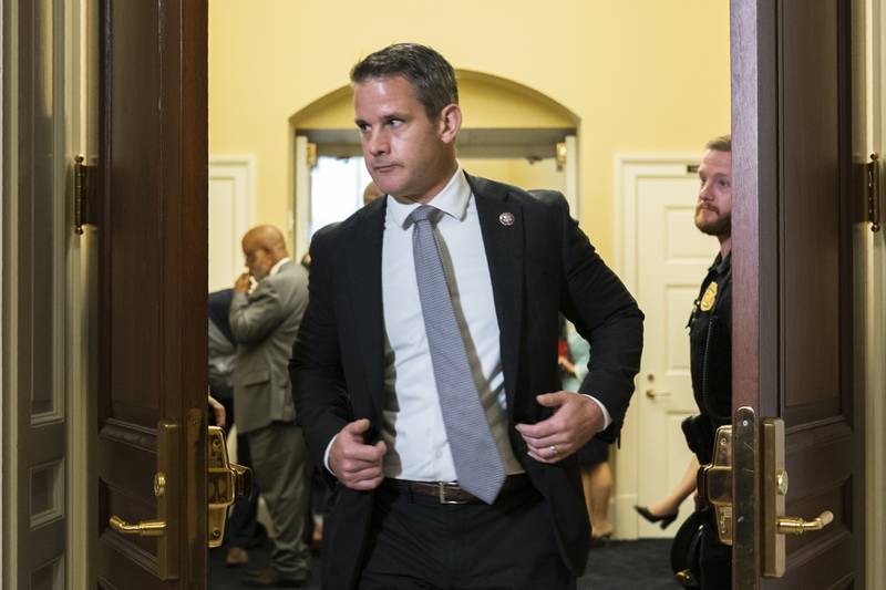 Rep. Adam Kinzinger, R-Ill., leaves a room as they take a break during the public hearing of the House select committee investigating the Jan. 6 attack on the U.S. Capitol, Monday, June 13, 2022, on Capitol Hill in Washington. Standing far back left is Chairman Bennie Thompson, D-Miss. (AP Photo/Manuel Balce Ceneta)