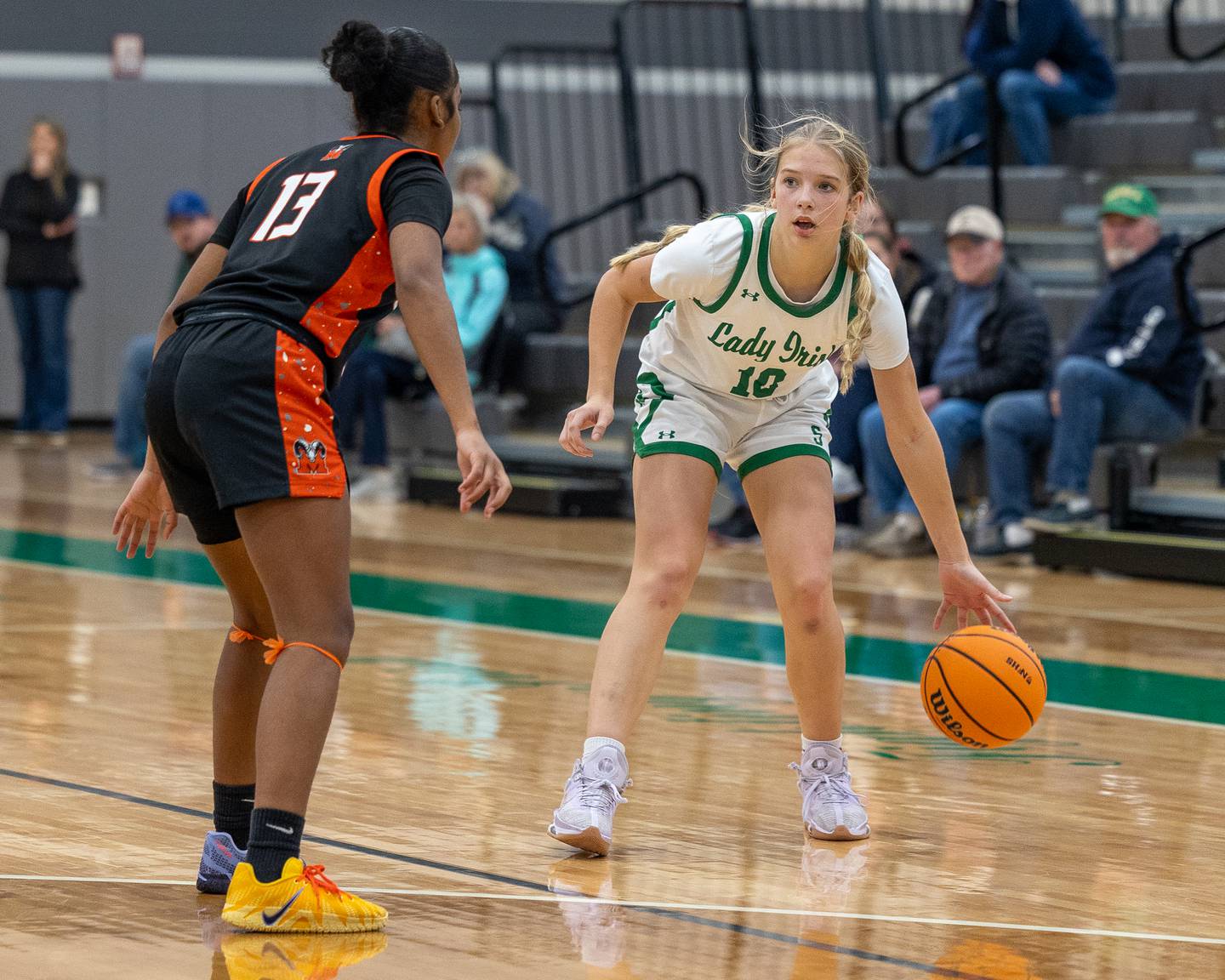 Graysen Provance (10) of Seneca dribbles ball as Ma'Kya Maxwell (13) of Peoria Manual stands guarding in a game earlier this season at Seneca High School in Seneca.
