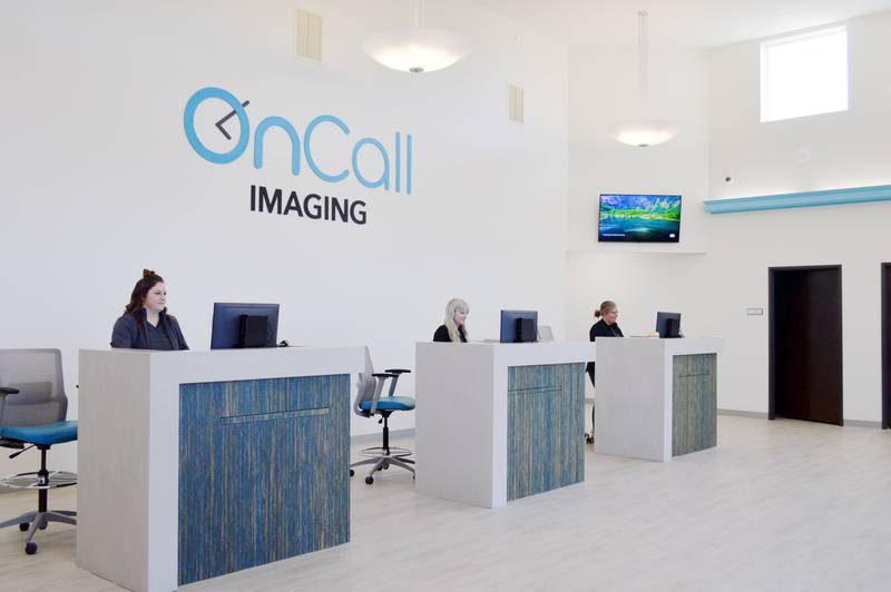 Three OnCall Imaging employees pose for a photo at the front desks of the new Rock Falls business on Monday, Oct. 16, 2023. OnCall Imaging, located at 1609 First Ave., Rock Falls, is a collaboration between OSF OnCall Digital Health and Imaging Centers of Illinois that will offer low-cost, non-invasive imaging services. It is set to open to patients on Oct. 30.