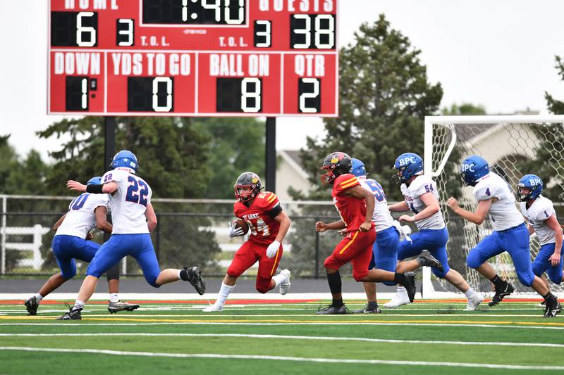 St. Anne's Quinton Thompsen makes a run during the Cardinals' 60-30 loss to Bushnell-Prairie City on Saturday, Aug. 26, 2023.