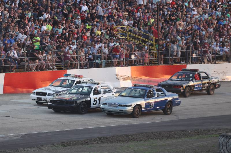 Police officers from Will and Grundy Counties race in the Five-O Race that raised over $180,000 for Special Olympics at Grundy County Speedway on June 15, 2024 in Morris.