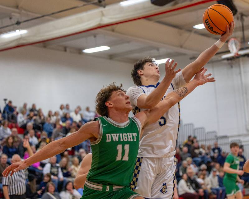 Marquette's Easton Debernardi (3) grabs rebound as Dwight's Joey Starks (11) reaches in on Saturday, Feb. 21, 2026 at Marseilles Elementary School.