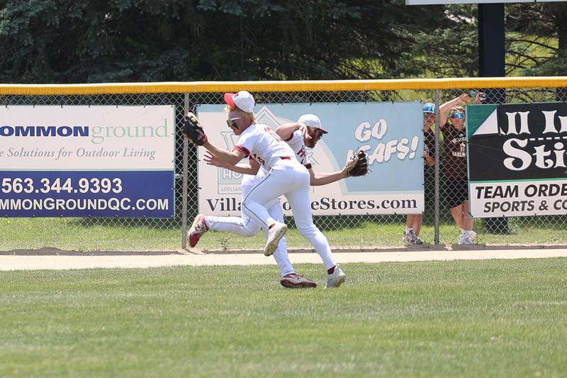 Spring Valley Hall’s Evan Stefaniak, 10, collides with Joel Koch after making a catch against Joliet Catholic in the Class 2A Geneseo Supersectional on Monday, May 29, 2023 in Geneseo.