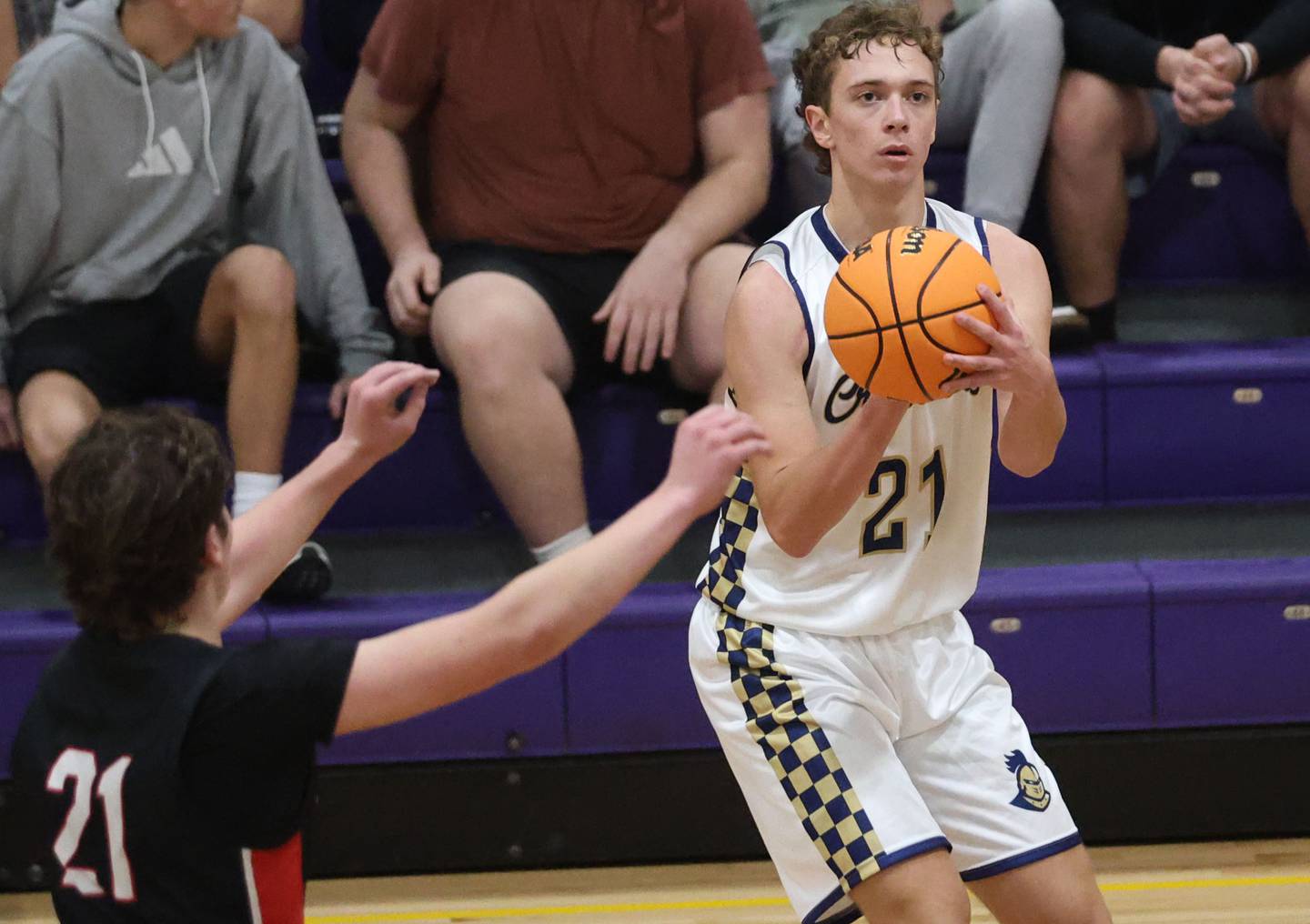Marquette's Lucas Craig looks up at the basket before taking a shot over Earlville's Landen Tirevold during the Huskers Hardwood Tip-Off Tournament on Tuesday, Nov. 25, 2025 in Serena.