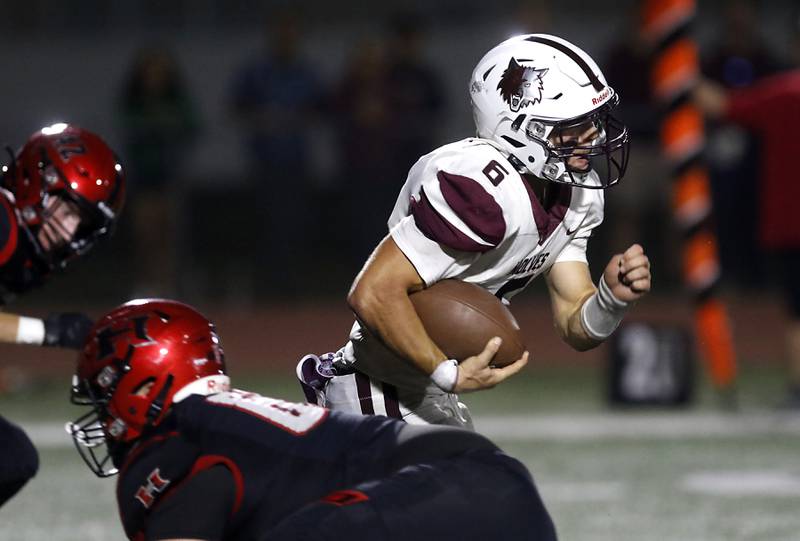 Prairie Ridge's Luke Vanderwiel breaks through the Huntley defense to run for a touchdown during a Fox Valley Conference football game on Friday, Oct. 3, 2025, at Huntley High School.